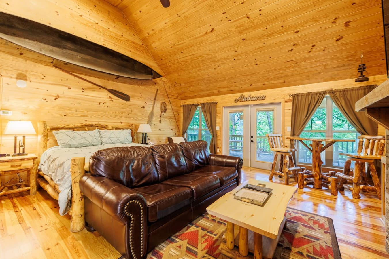 Cozy couch facing the indoor fireplace.