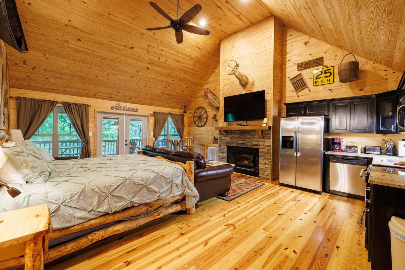 Open floor plan with river views, king bed, fireplace & comfy seating.