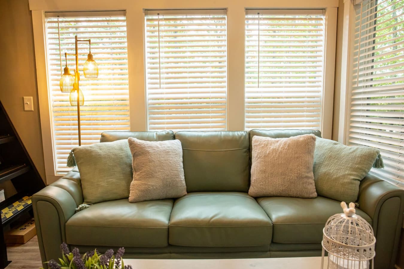 Gather for movie nights, morning coffee, or quiet reading in this inviting space surrounded by nature.