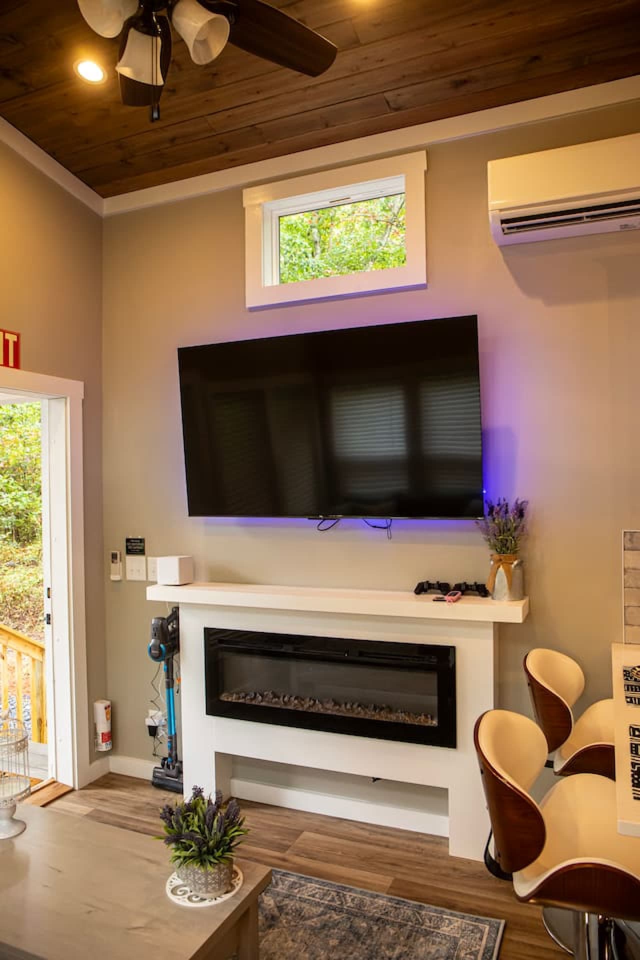 Large flat screen tv with fireplace.