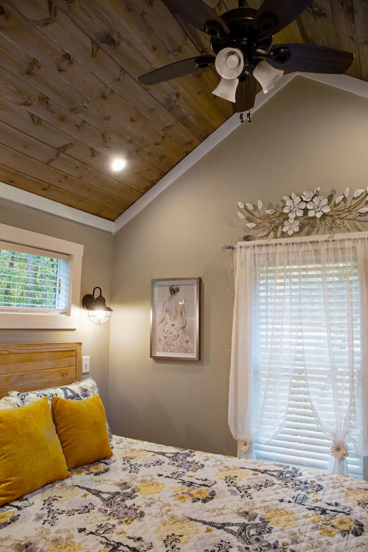 Bedroom with tongue and groove vaulted ceiling.