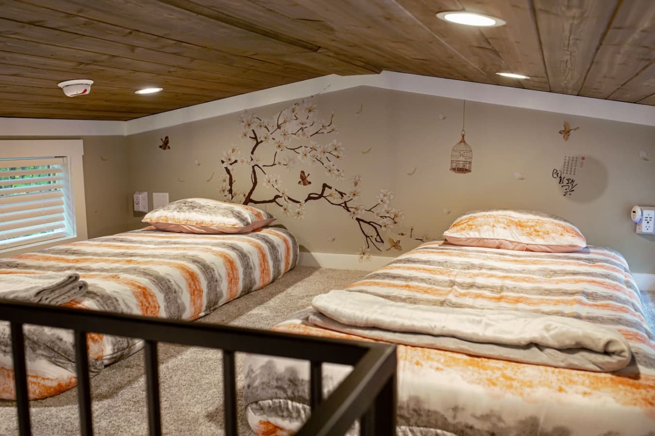 Low ceilings, high charm—this loft is perfect for kids or cozy nights under the eaves.