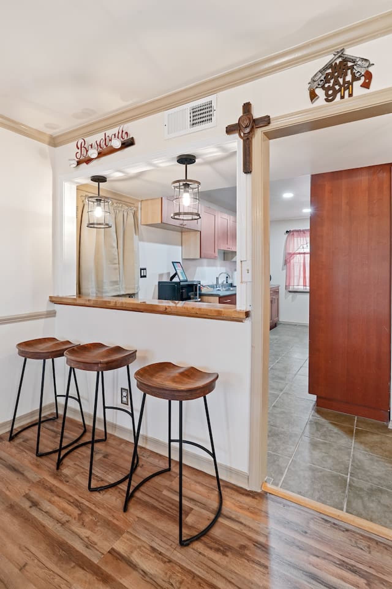 Kitchen convenience meets entertainment with bar area perfect for hosting and relaxing.