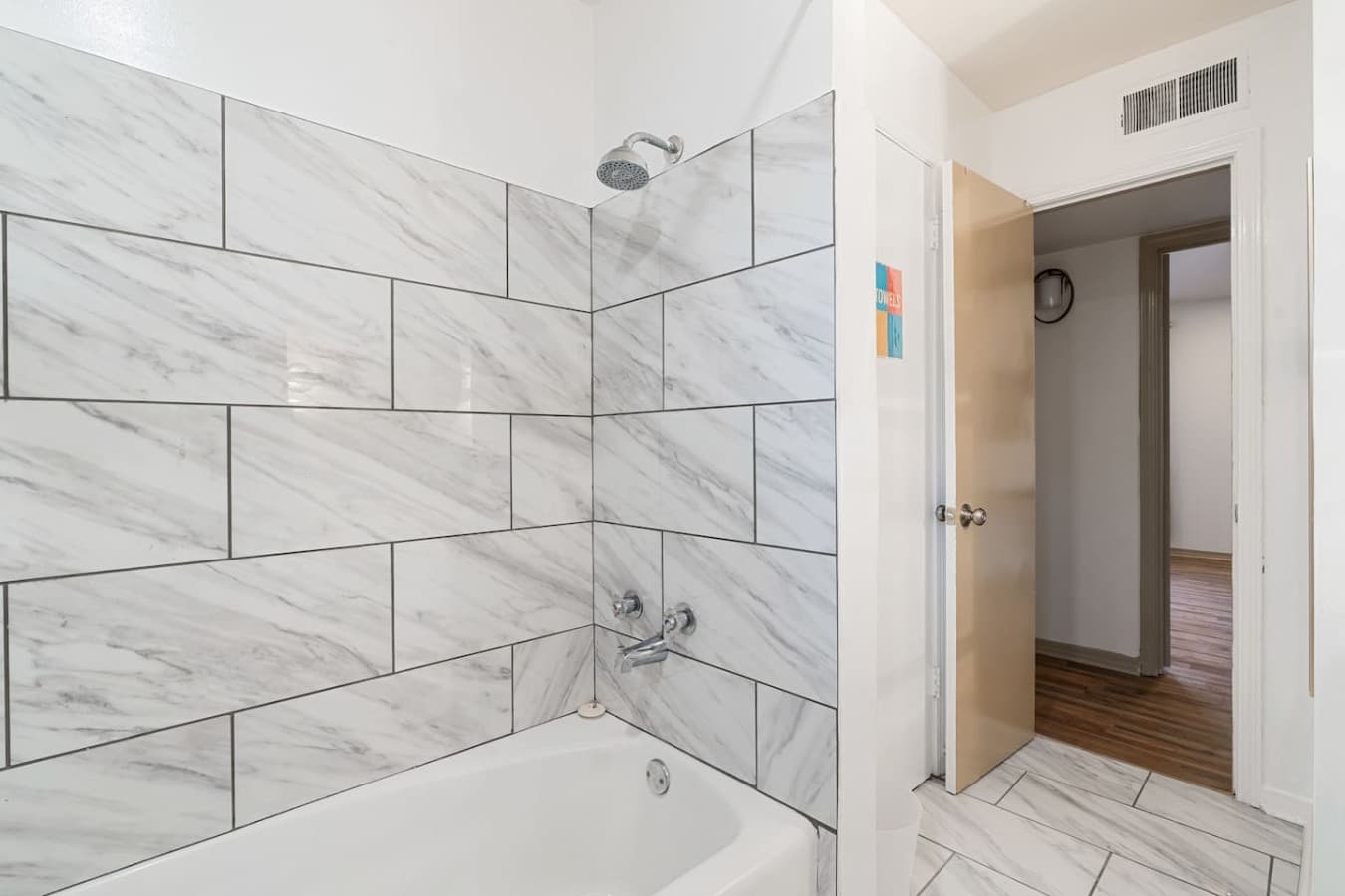 Enjoy a refreshing shower with hot water and premium bath products provided.