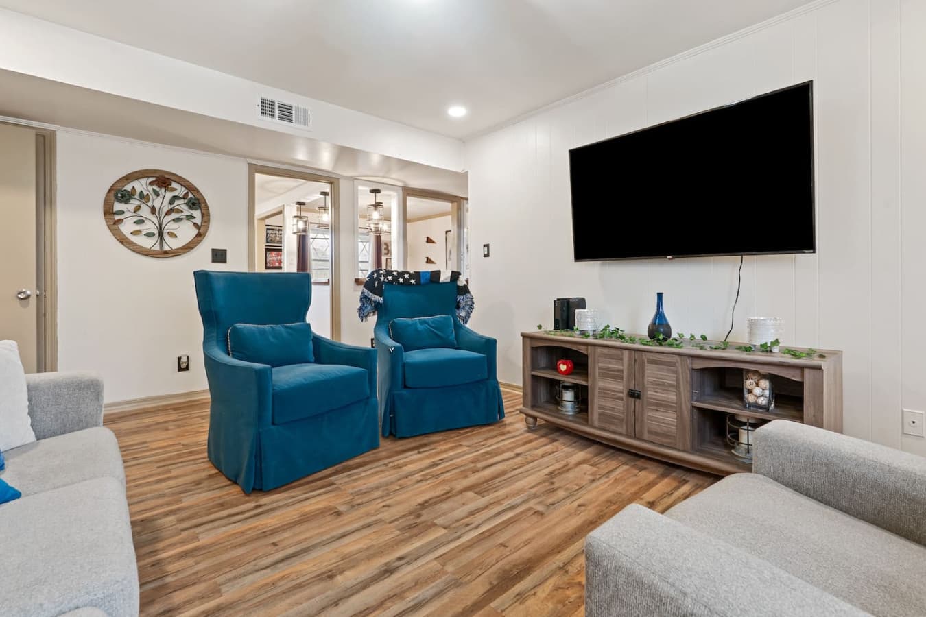 Your entertainment hub featuring smart TV and relaxing atmosphere.