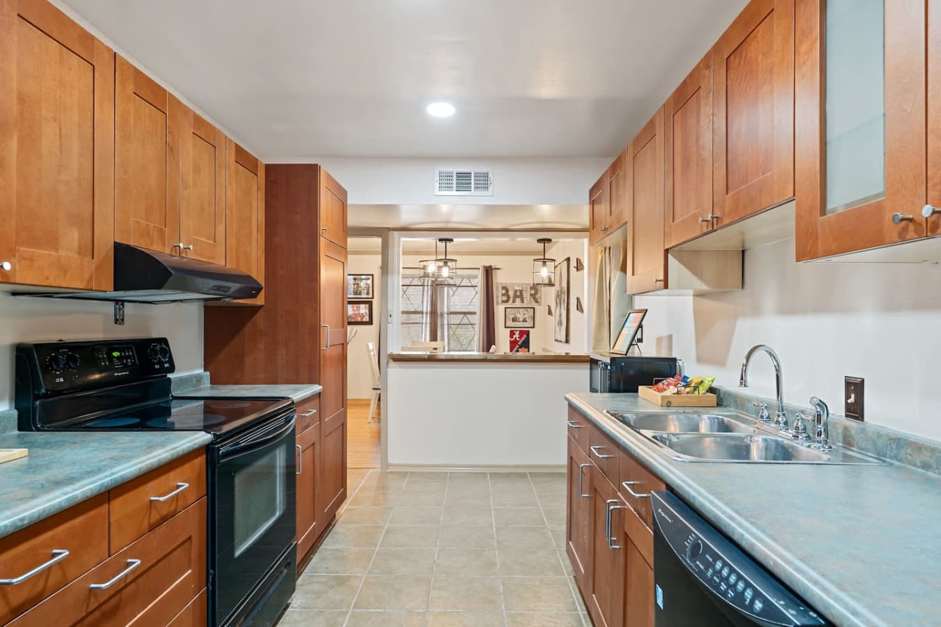 Cook like you're at home with full kitchen featuring stove, oven, microwave, and dishwasher.
