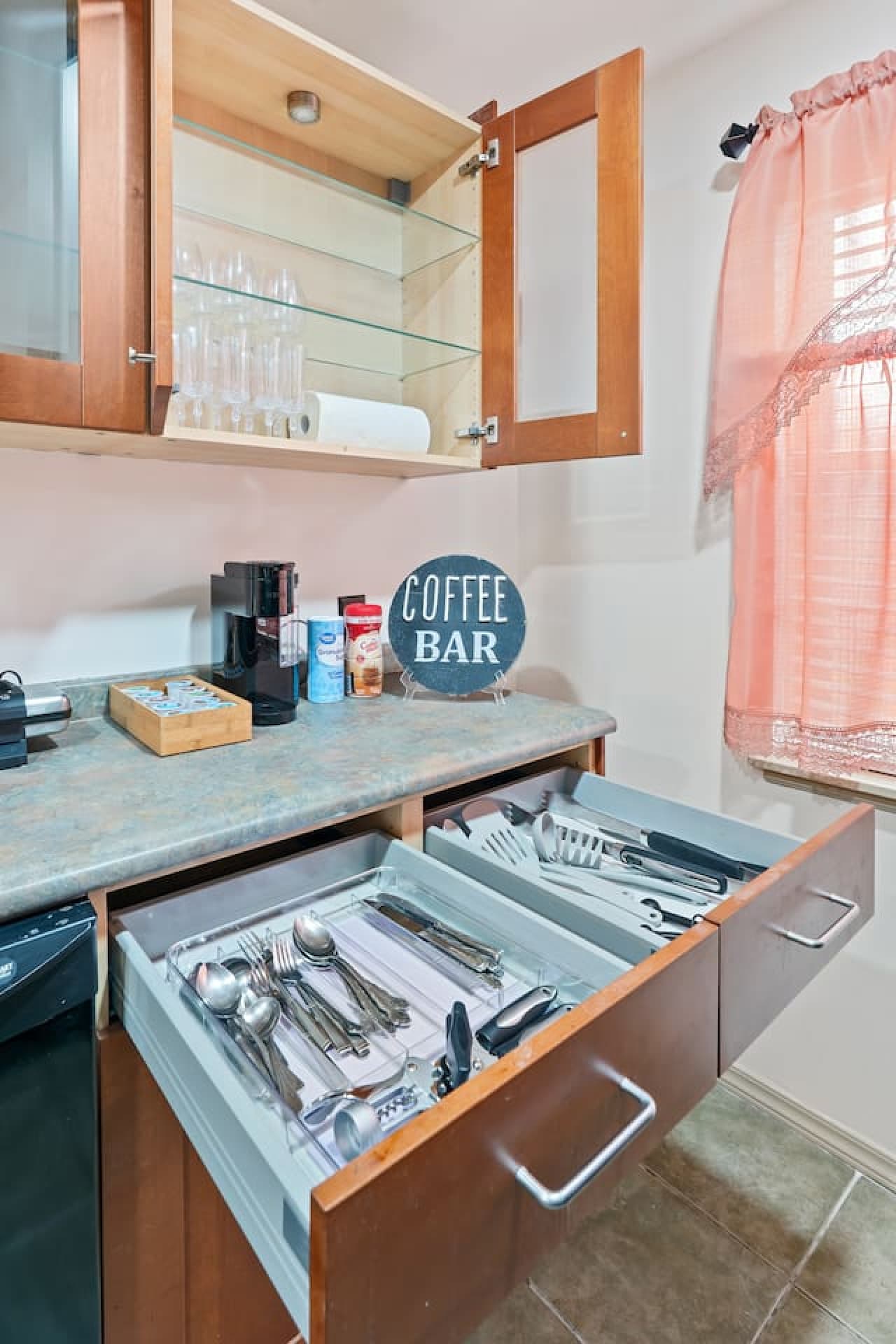 All the essentials provided: pots, pans, dishes, silverware, wine glasses, and cooking basics.