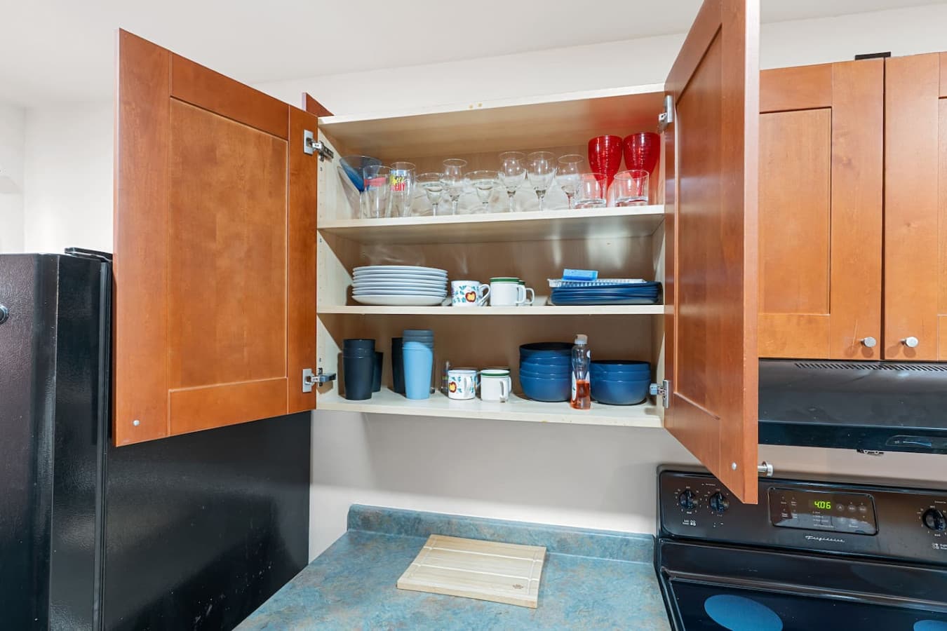All the essentials provided: pots, pans, dishes, silverware, wine glasses, and cooking basics.