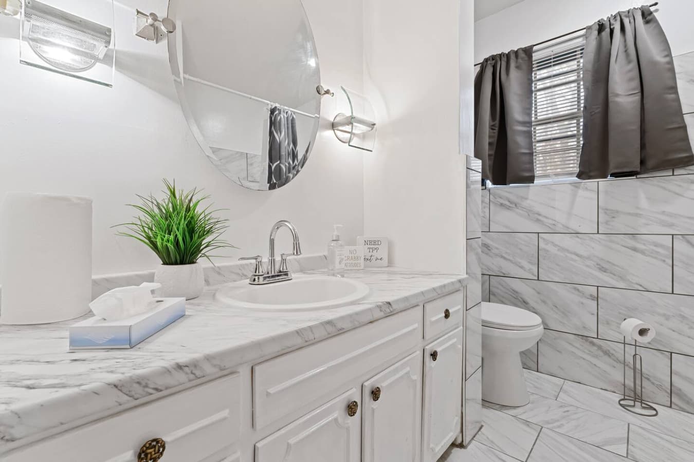 Refresh in the downstairs bathroom with shower, fresh towels, and premium toiletries.