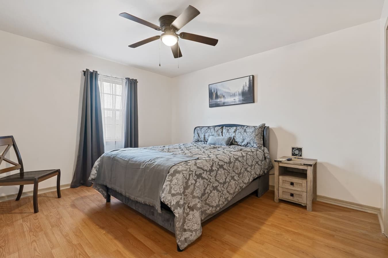 Relax in this comfortable second bedroom with fresh linens and modern entertainment.