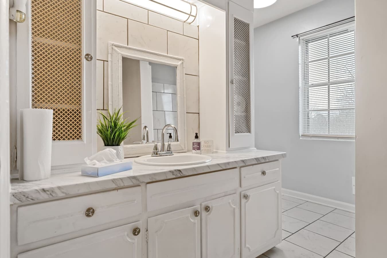 Upstairs bathroom serving three bedrooms with shower and premium amenities.
