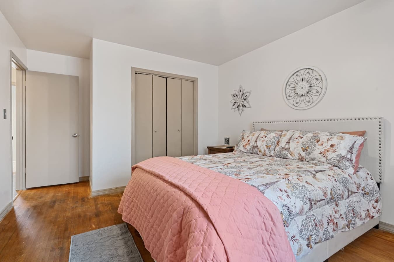 Rest easy in this comfortable bedroom featuring fresh linens and modern amenities.