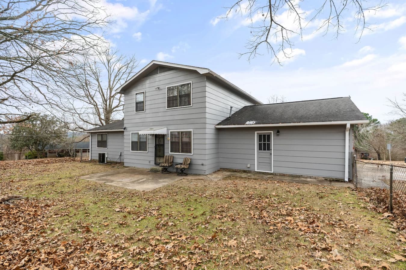 Enjoy your morning coffee in the spacious private backyard surrounded by open grass.