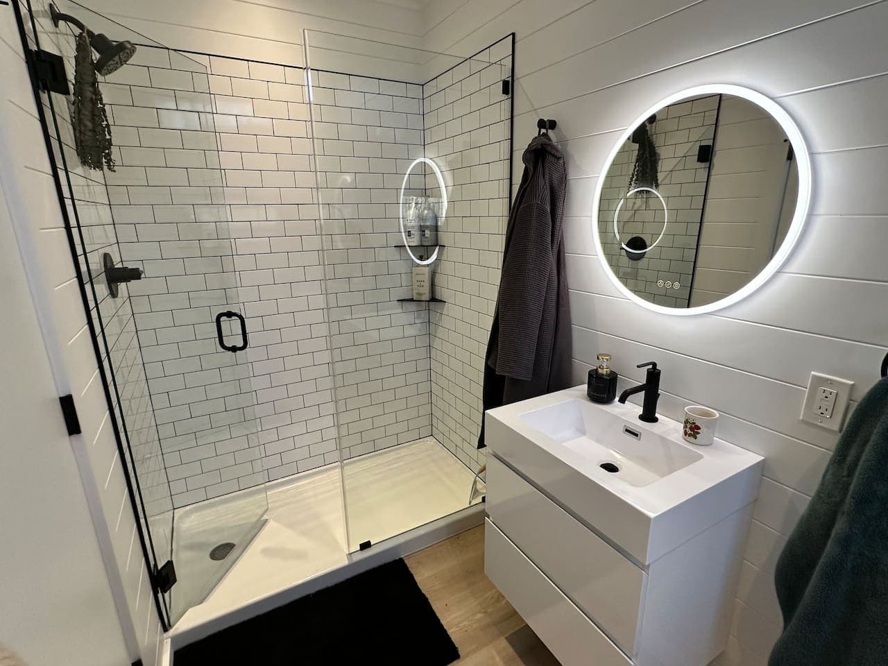 Unwind in a sleek, modern bathroom with a spacious tiled shower and a touch of luxury.