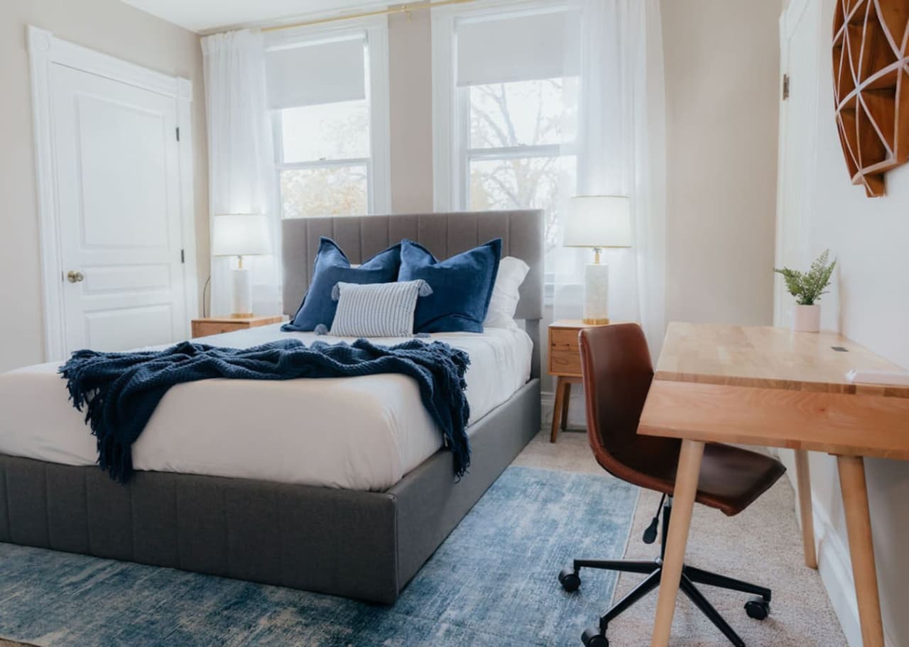 Queen bed with a dedicated workspace.