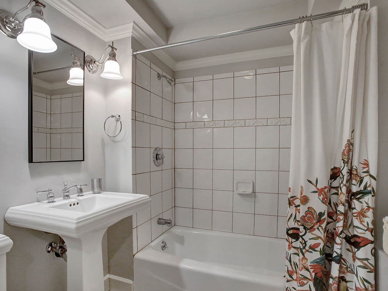 Full bathroom with shower-tub combo.