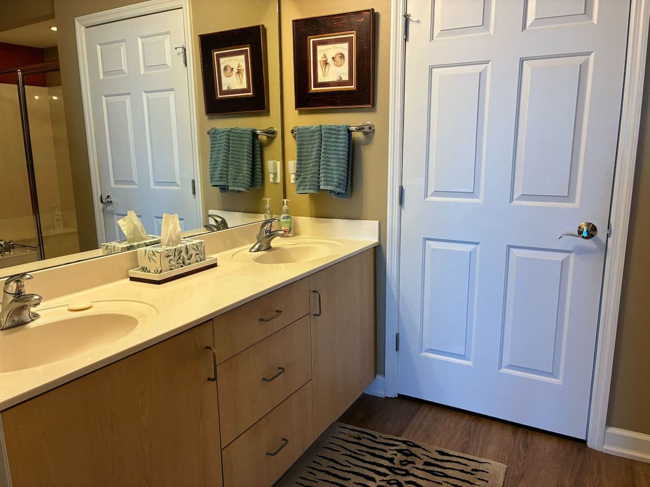 Double sinks, fresh towels, and a calm space to reset after the beach.