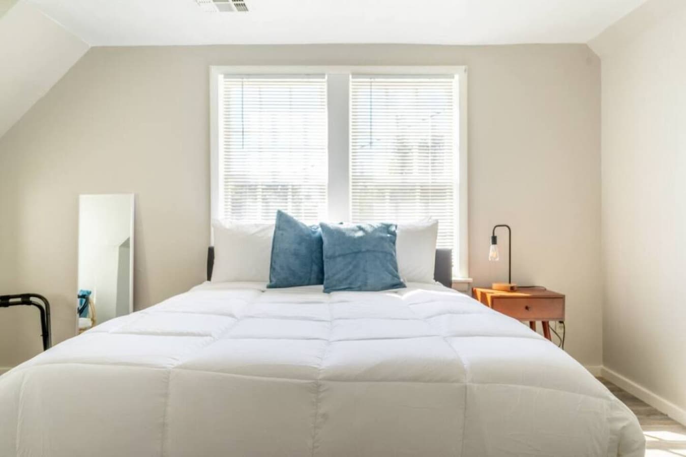 Relax in a light-filled queen bedroom with fresh linens.