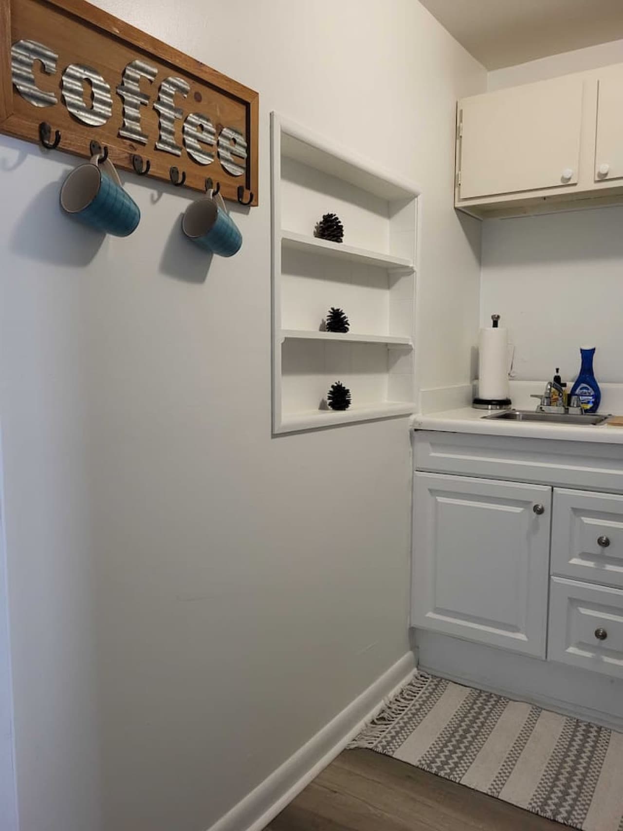 Cozy kitchen vibes — coffee cups ready and charming touches to start your day.