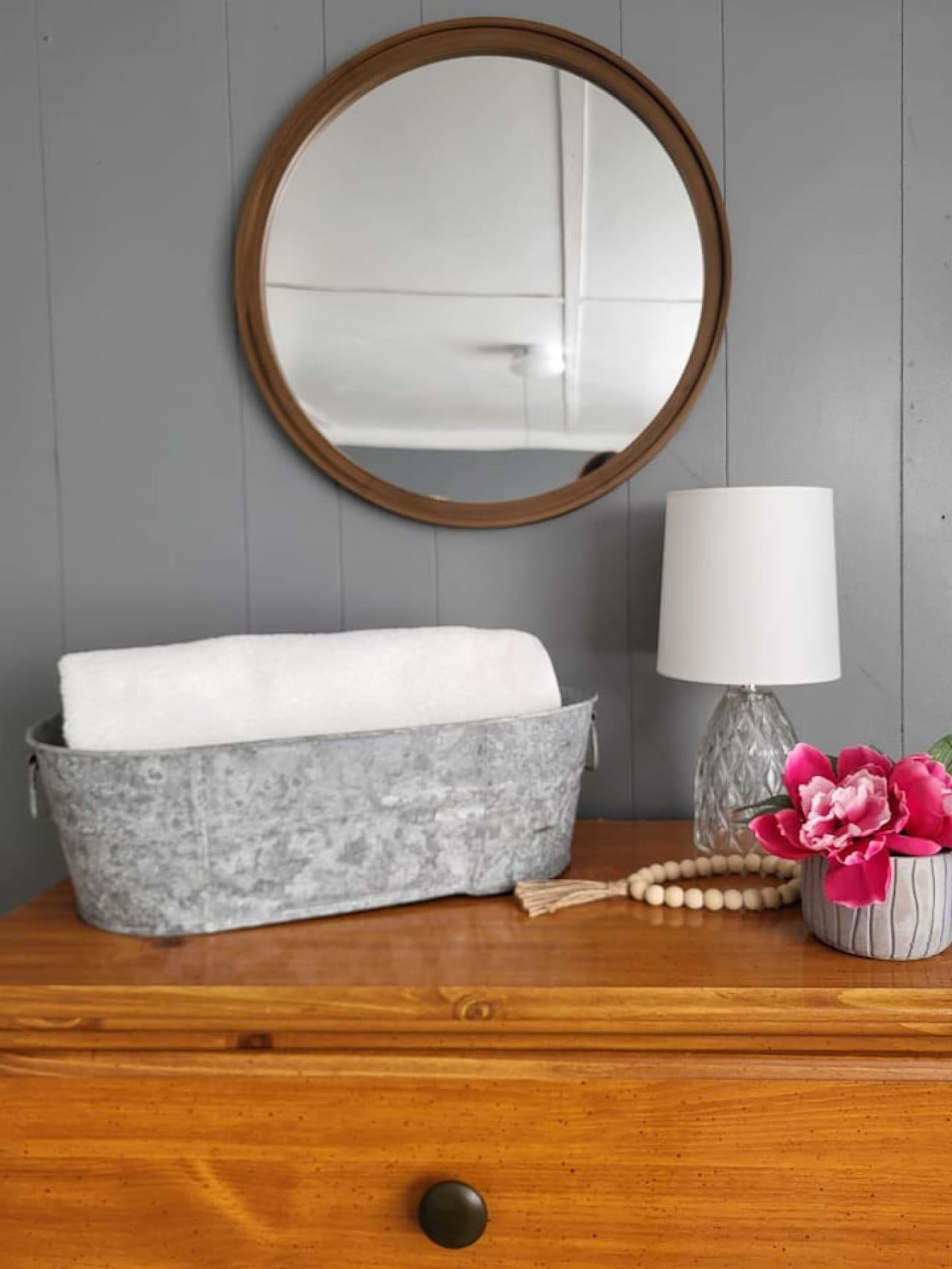 Relax, recharge, and check your look — this mirror adds both style and practicality.