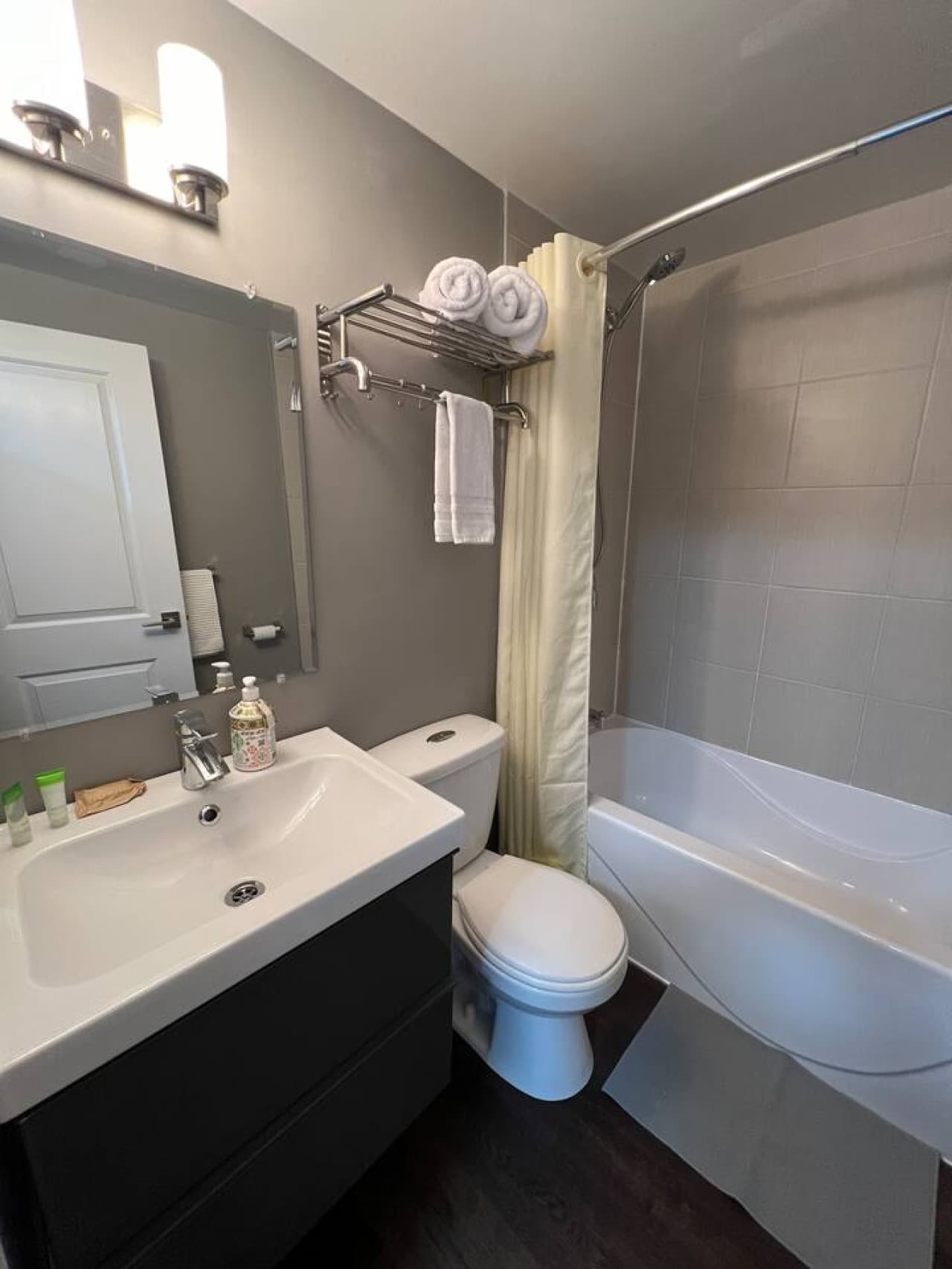 The bathroom has all the essentials, including fresh towels and toiletries, for a comfortable and relaxing stay.