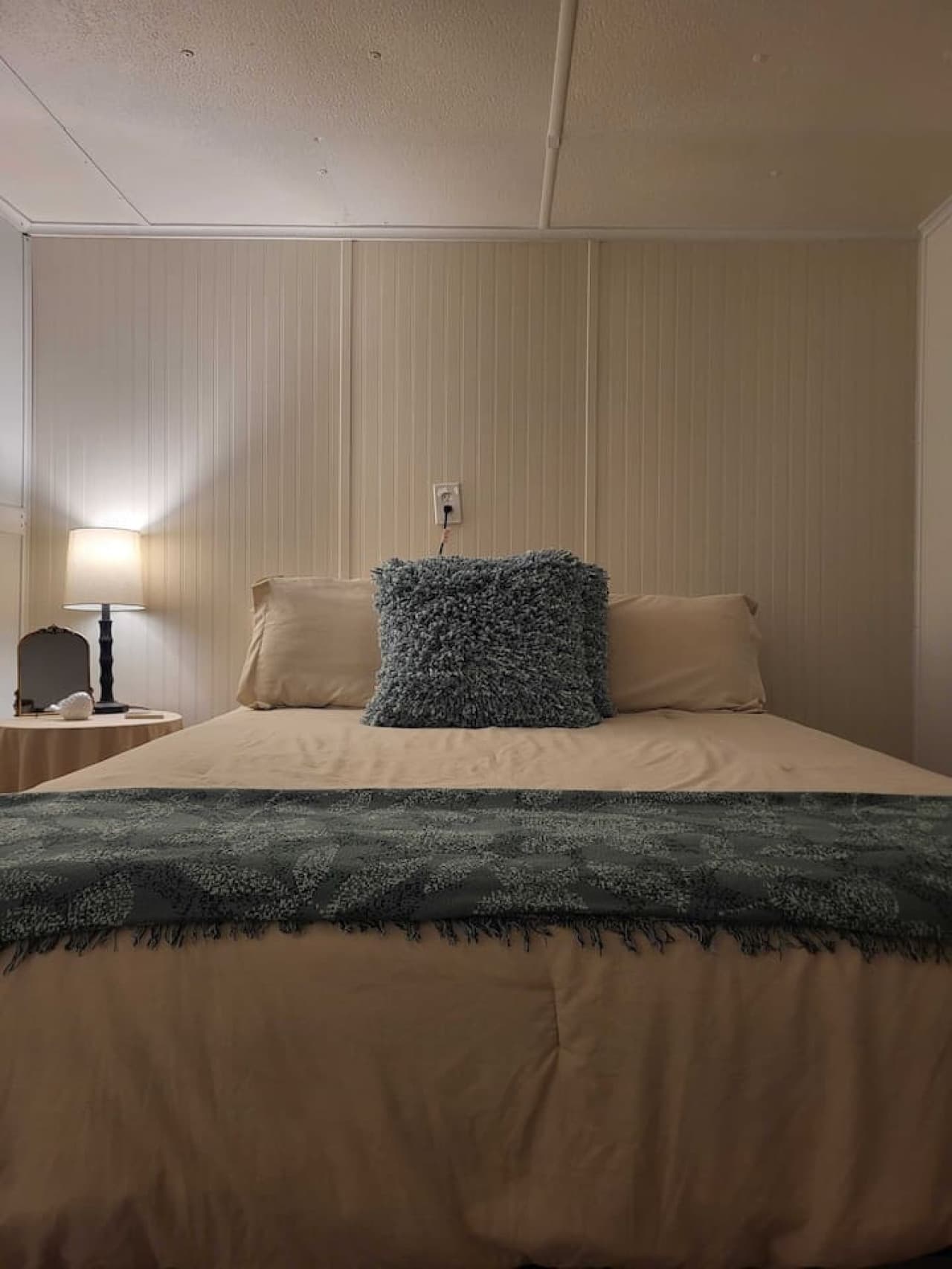 A serene retreat featuring a comfortable queen bed and ample closet space for all your lakeside gear.