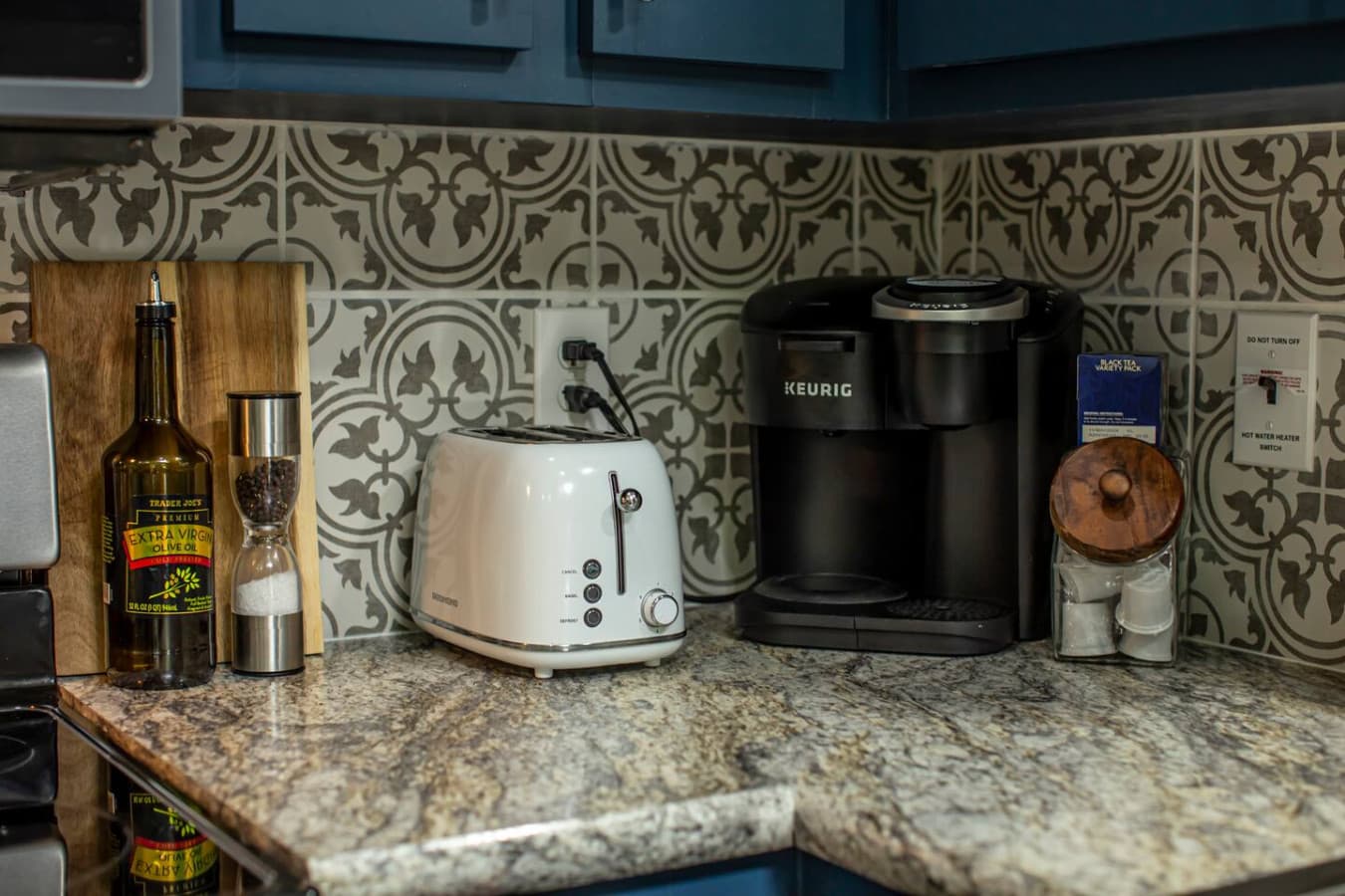 The coffee corner features both a drip and Keurig coffee maker, with a starter kit that includes two packs of ground coffee, two K-Cups, creamer, and sugar.