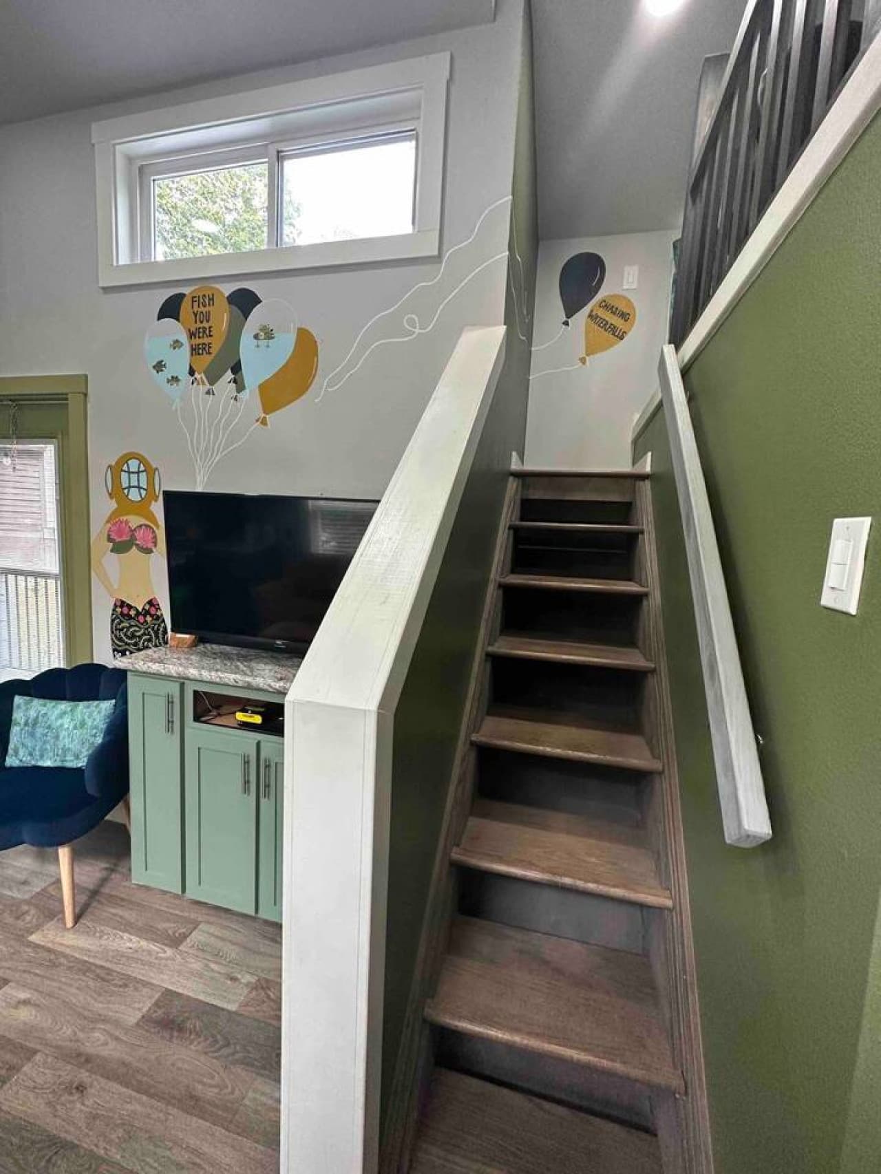 Loft stairs leading up to the cozy sleeping area.