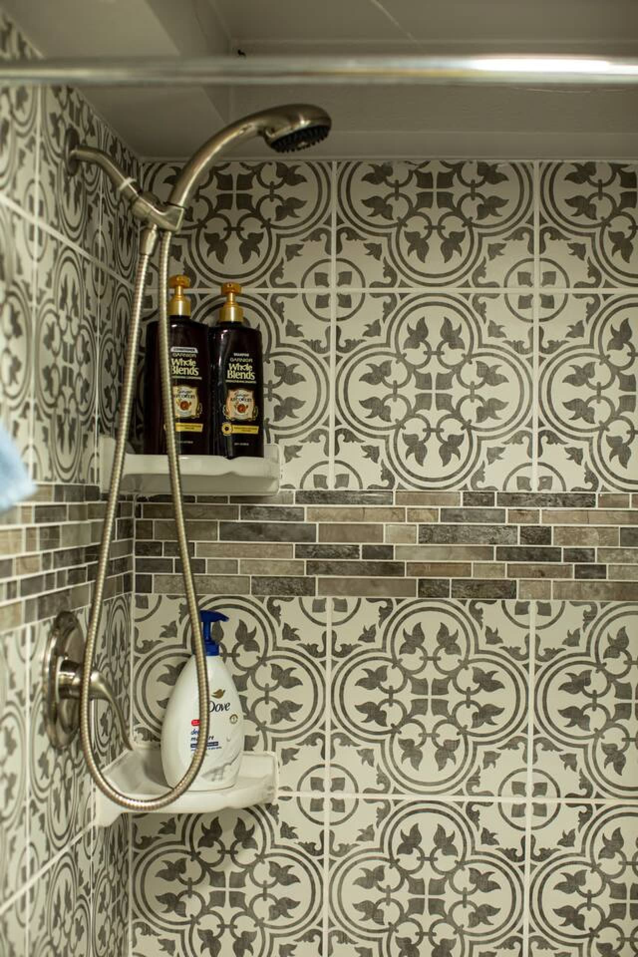 The full bathroom features a shower and comes stocked with shampoo, conditioner, and body wash, along with one towel and washcloth provided per guest.