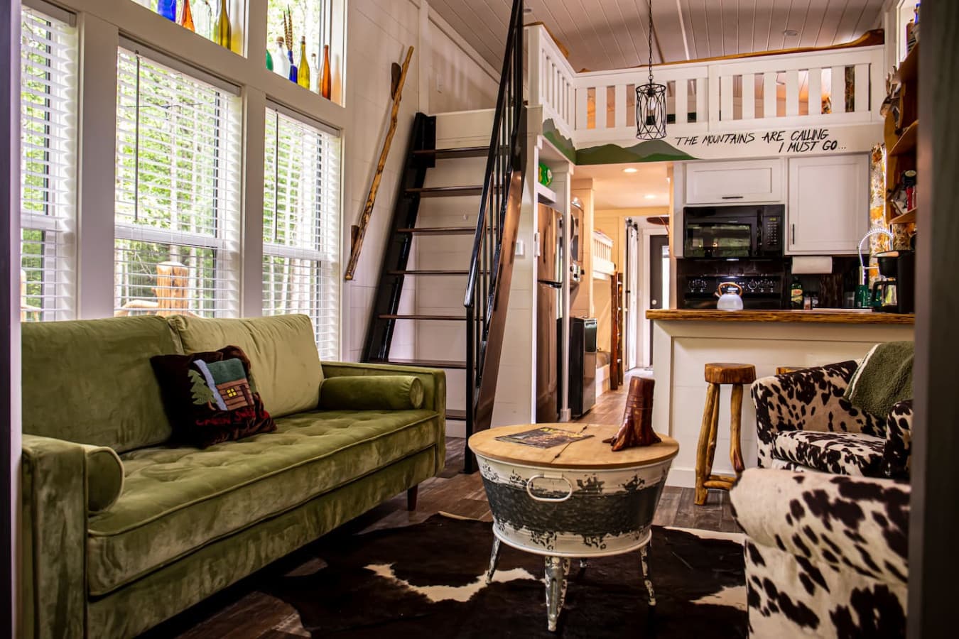 Bright and cozy living room stocked with games (monopoly, monopoly deal, Yahtzee, uno, and cards) and TV with lots of DVDs for all ages as well as free access to YouTube TV.