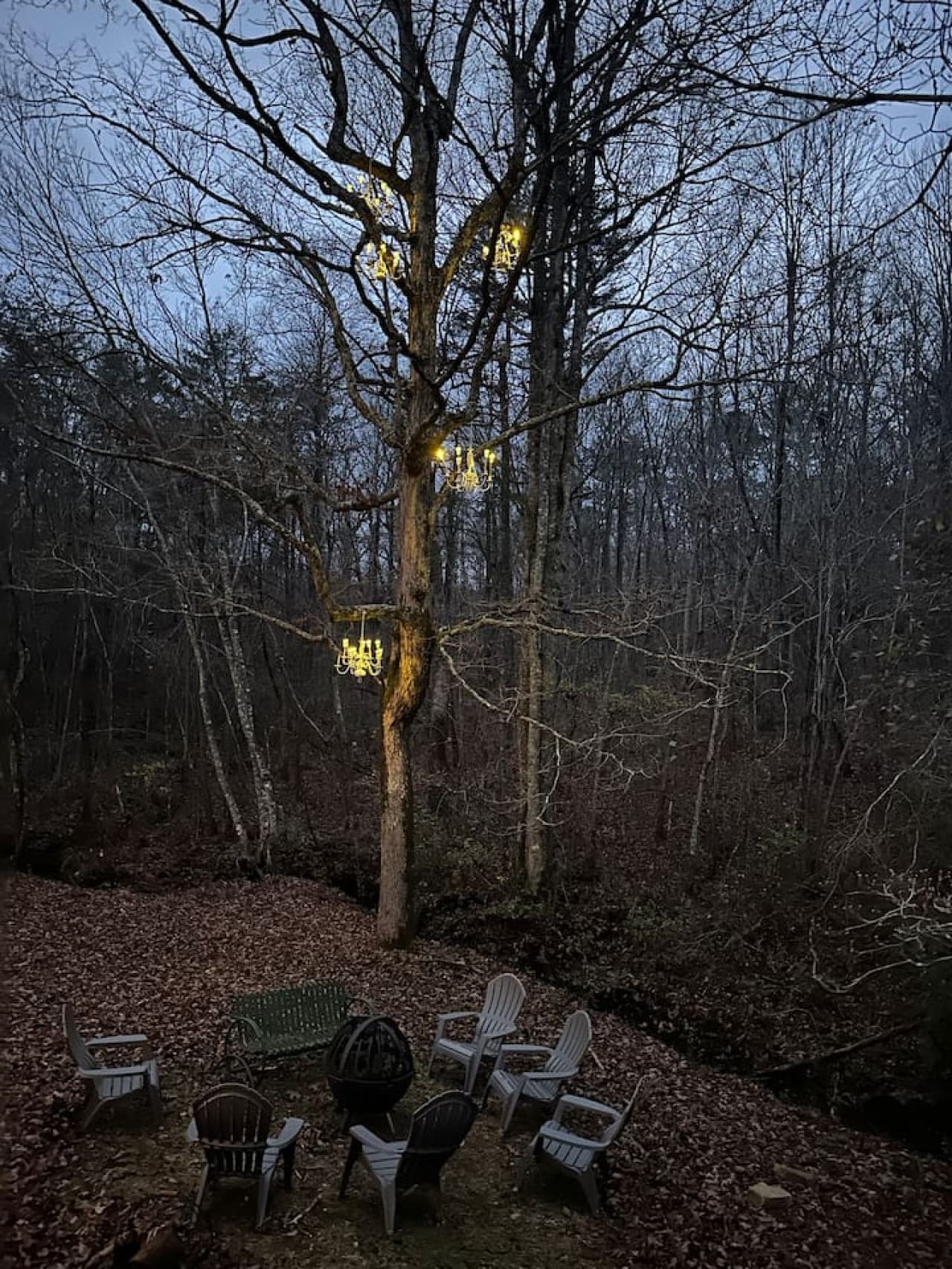 Part of the chandelier garden is in the big tree behind the Crooked Tree Cabin. Enjoy a whimsical view and starlit sky while making s’mores and relaxing around the wood burning fire pit.