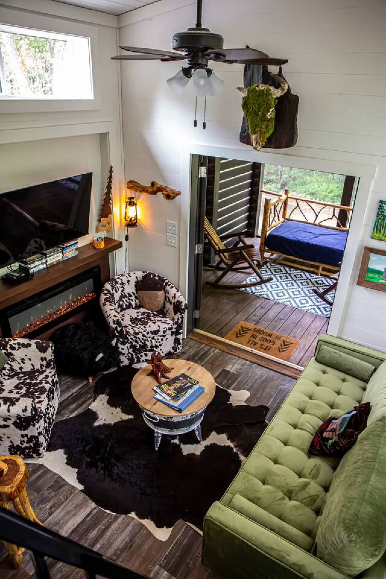 The view of the living area as well as the screened in porch from the loft.