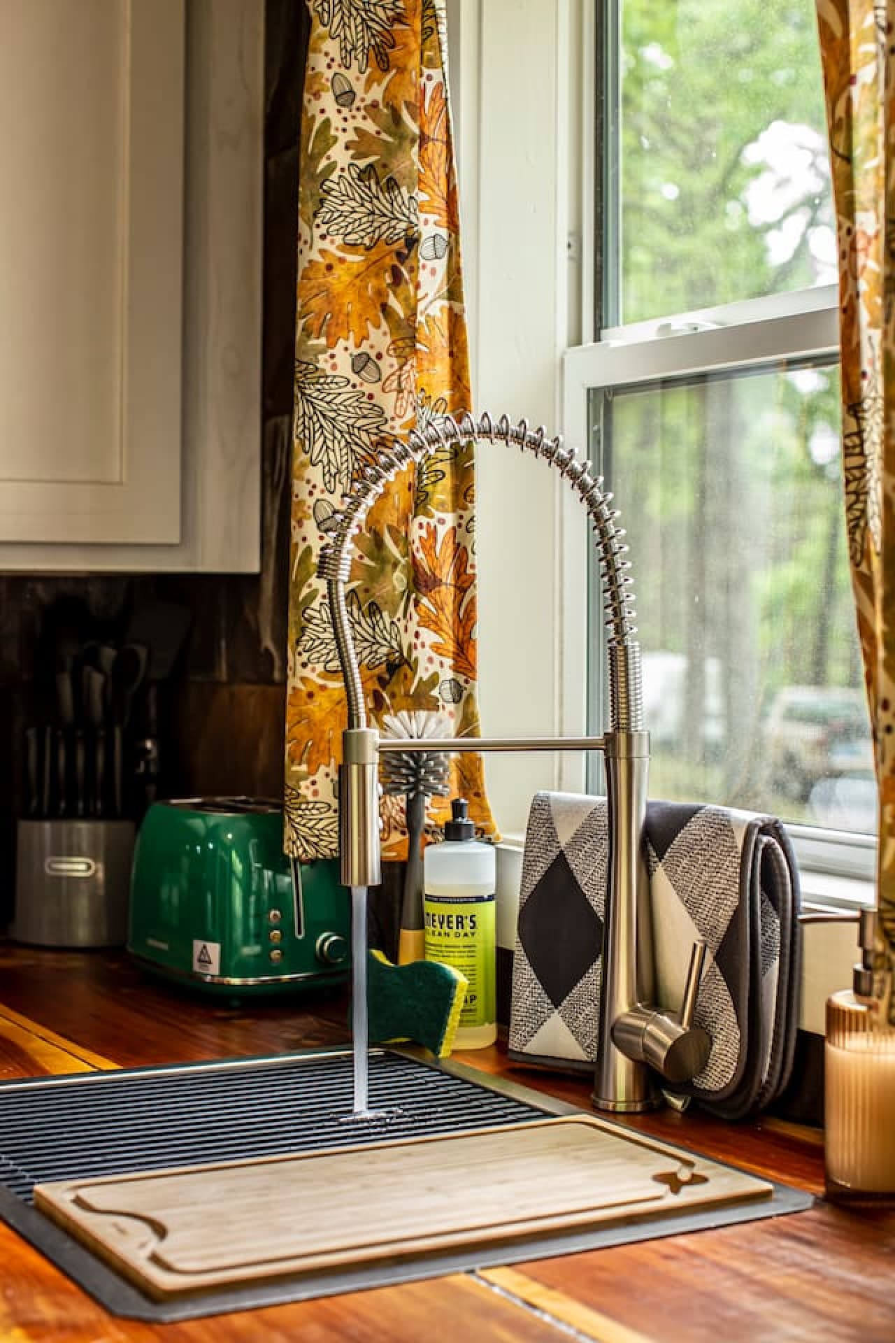 The kitchen sink provides plenty of space for meal prep and cleanup, complete with starter dish soap and essentials.