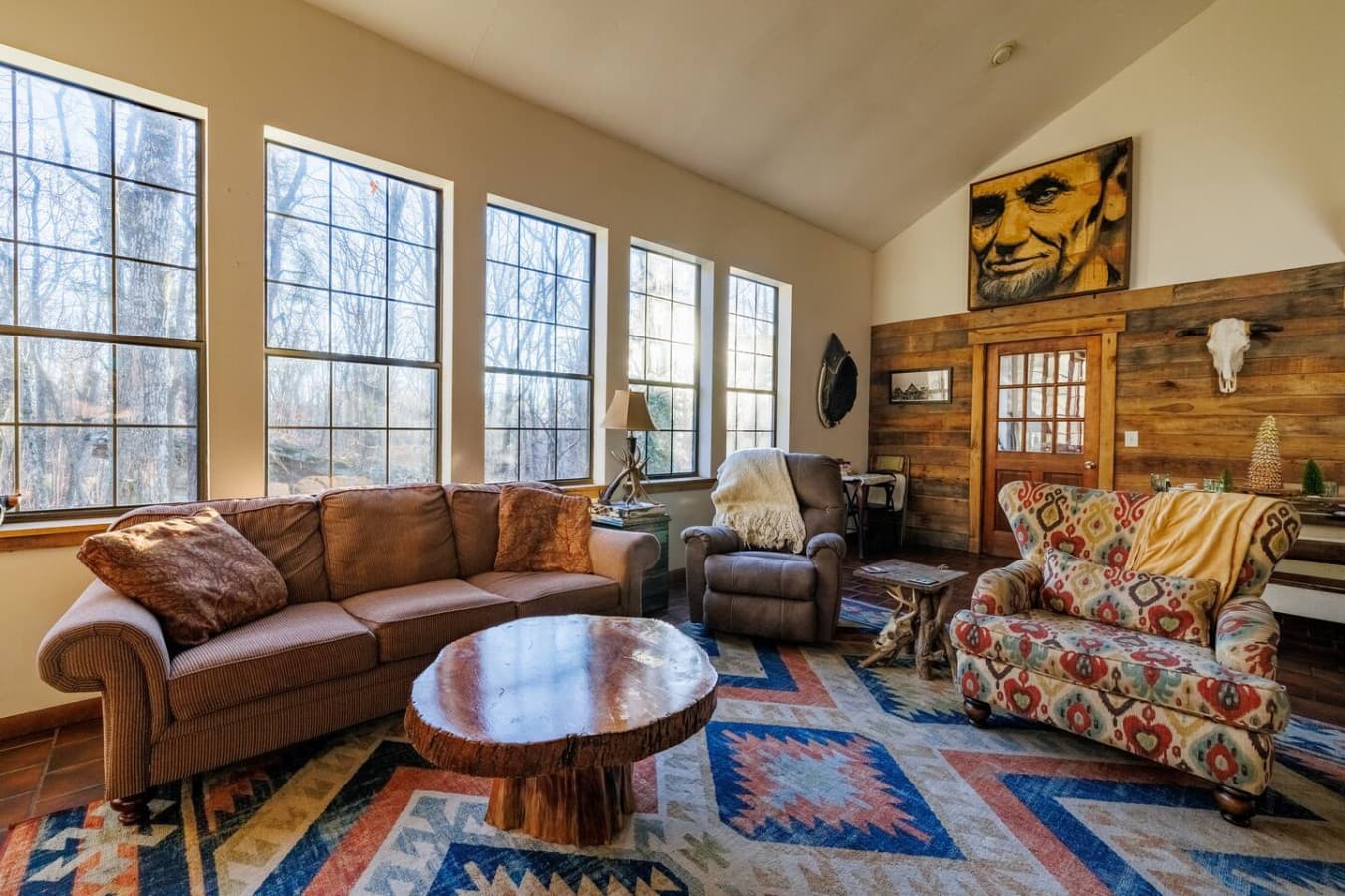 Spacious and bright with large windows overlooking the wooded surroundings.