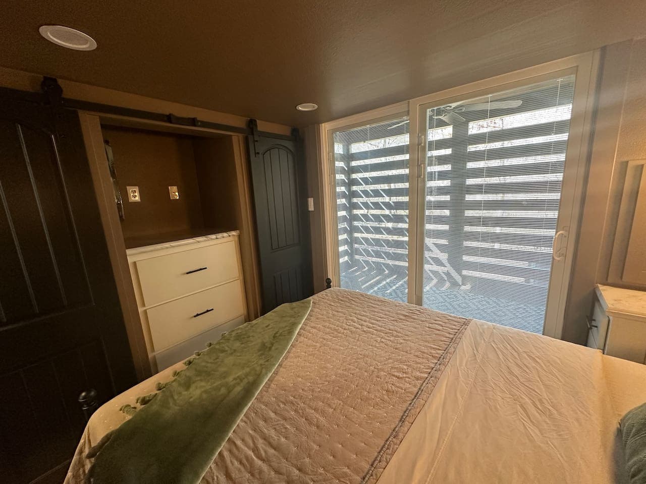 The sliding glass doors leads to the covered back porch and hot tub.