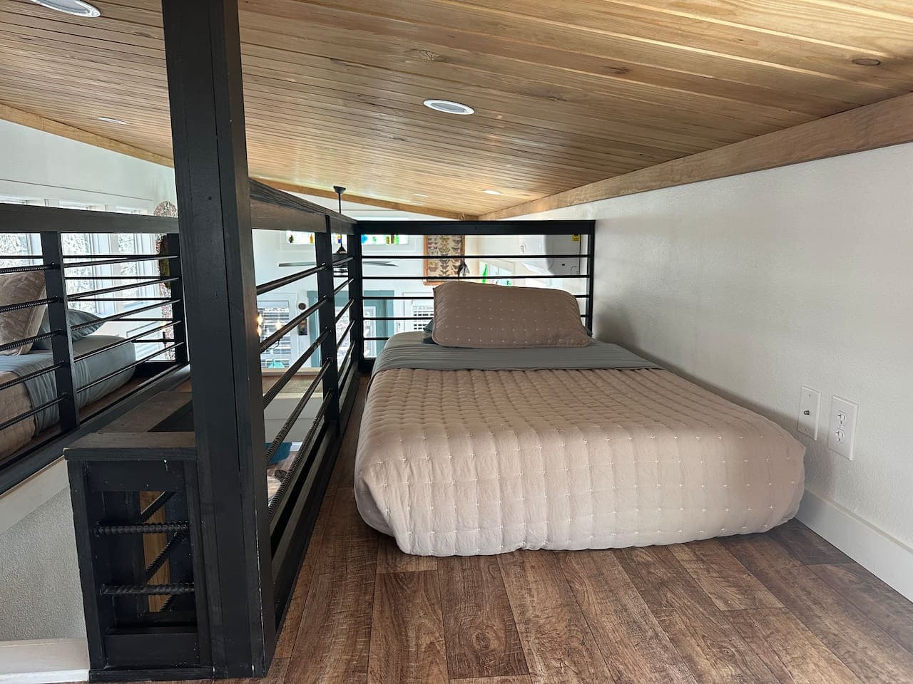 The other side of the loft—another twin bed, perfect for sibling rivalries, secret giggles, or claiming “the better side” of the room.