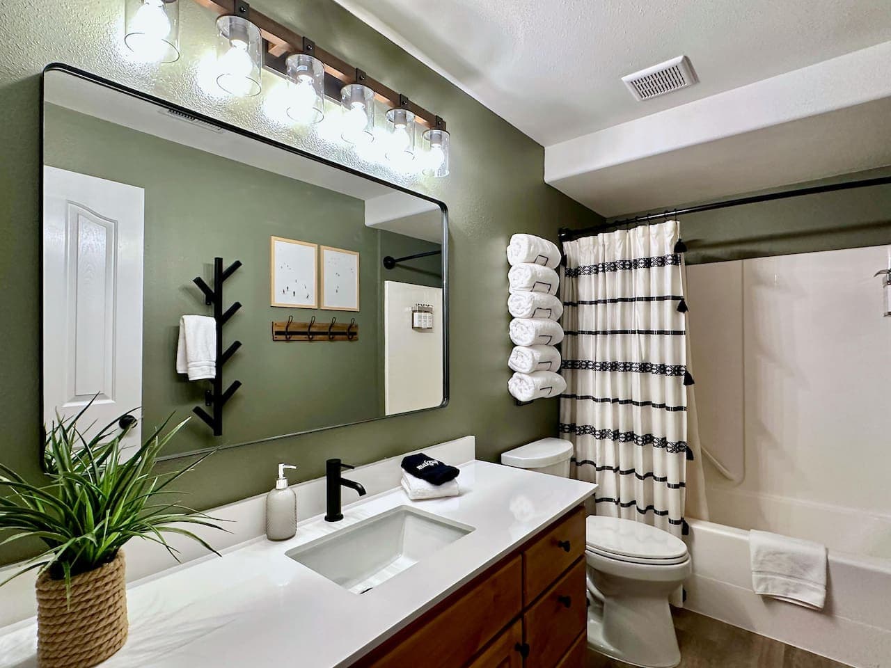 Step into the sleek second bathroom equipped with modern fixtures and a refreshing shower that are perfect for recharging after your day’s adventures.