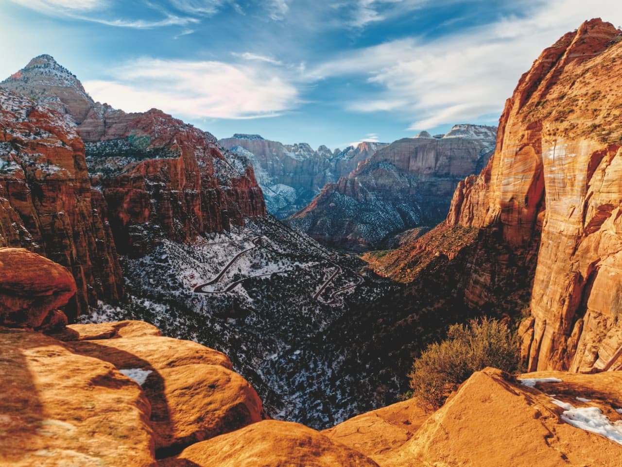 Explore the towering majesty of Zion National Park's iconic red cliffs and lush greenery. Nature's grandeur at its most awe-inspiring!