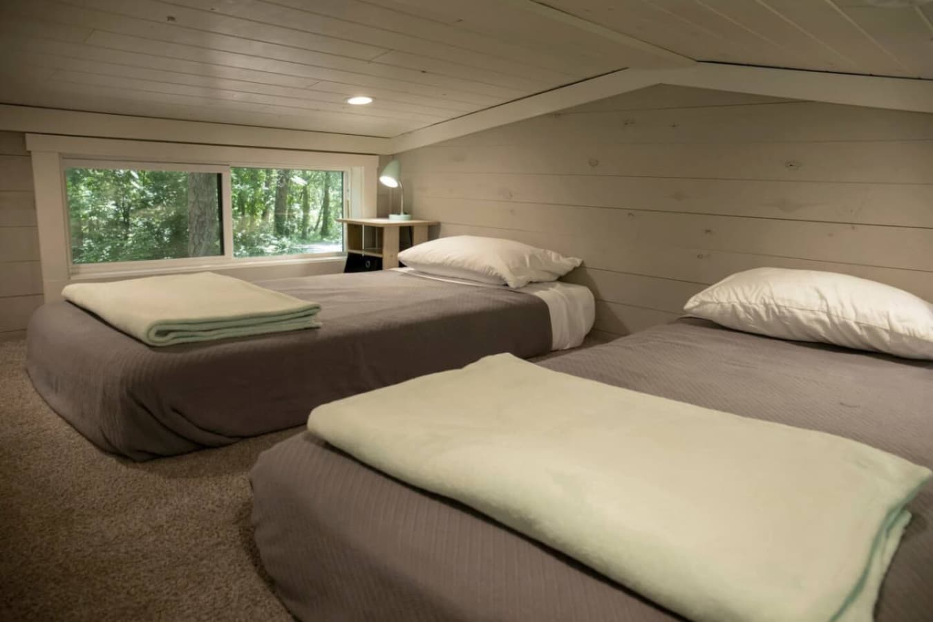 The loft features two cozy twin beds, perfect for a restful night’s sleep.