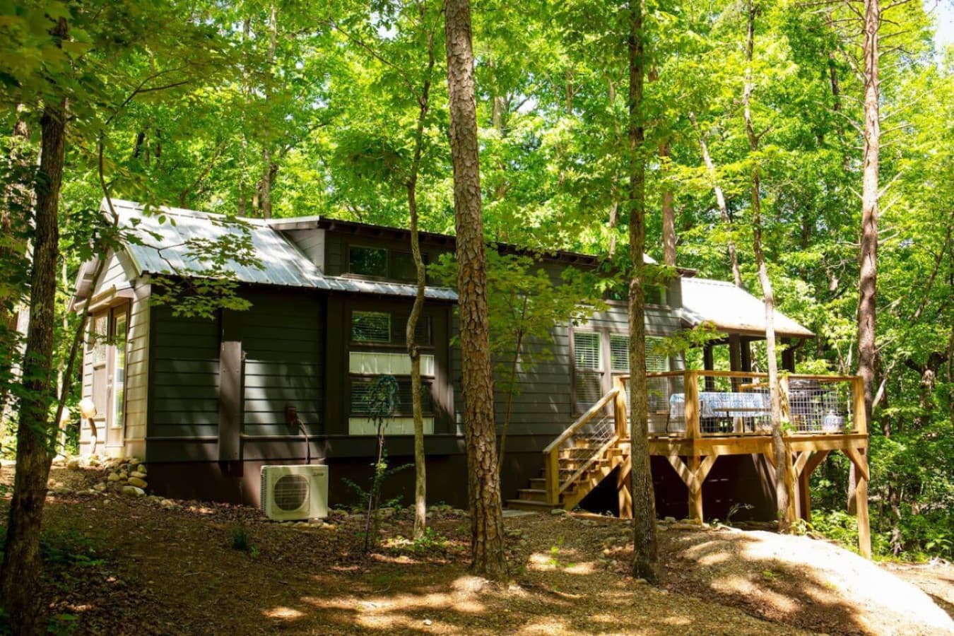 The East Fork Cottage is tucked away in the woods, right next to the serene East Fork of the Little River.