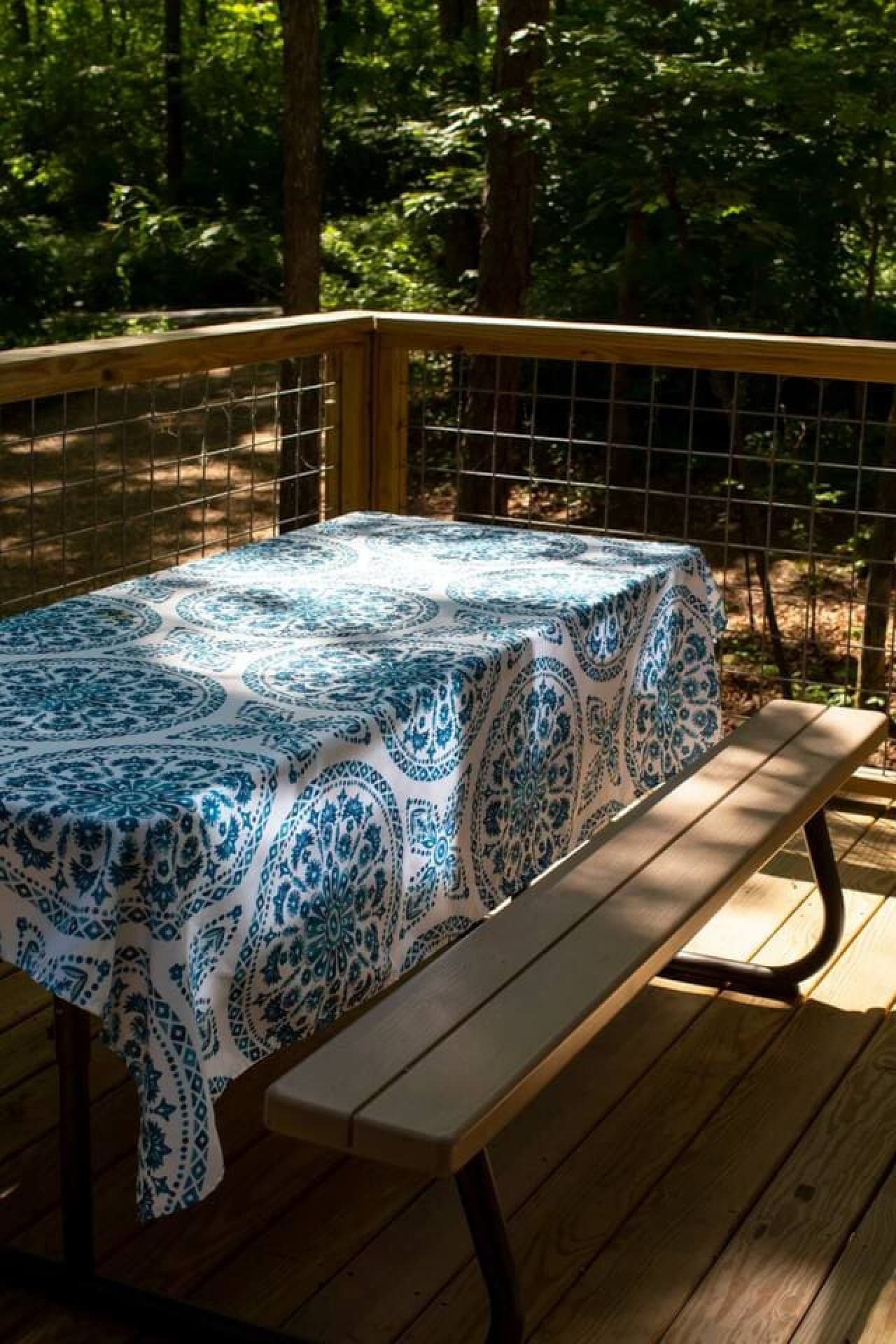 Enjoy a peaceful picnic in the uncovered porch area, perfect for grilling and dining al fresco.