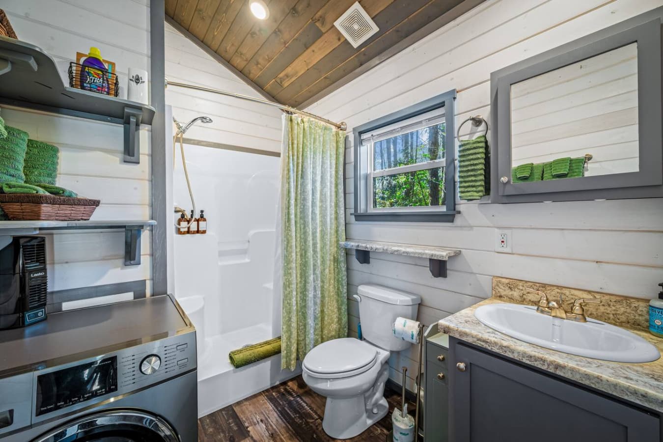 Refresh in the shower with a built-in bench, stocked with shampoo, conditioner, and body wash for an easy start or end to your day—plus convenient in-unit laundry to keep everything fresh throughout your stay.