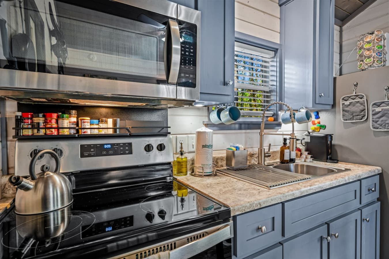 Stainless steel appliances and provided essentials make everything from quick breakfasts to cozy dinners effortless.