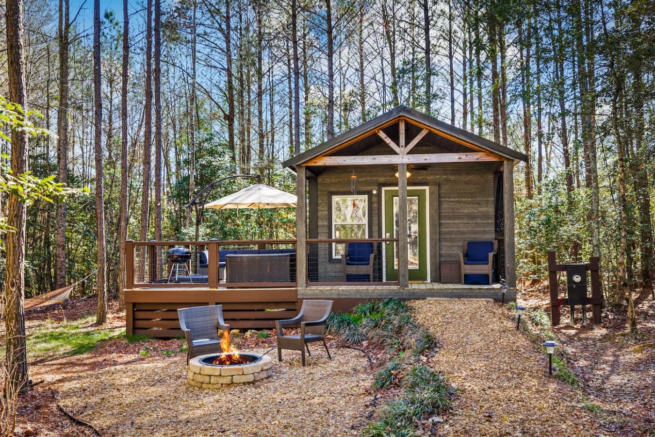 Enjoy the inviting front yard with a fire pit, ideal for relaxing nights, roasting s’mores, and making lasting memories outdoors.