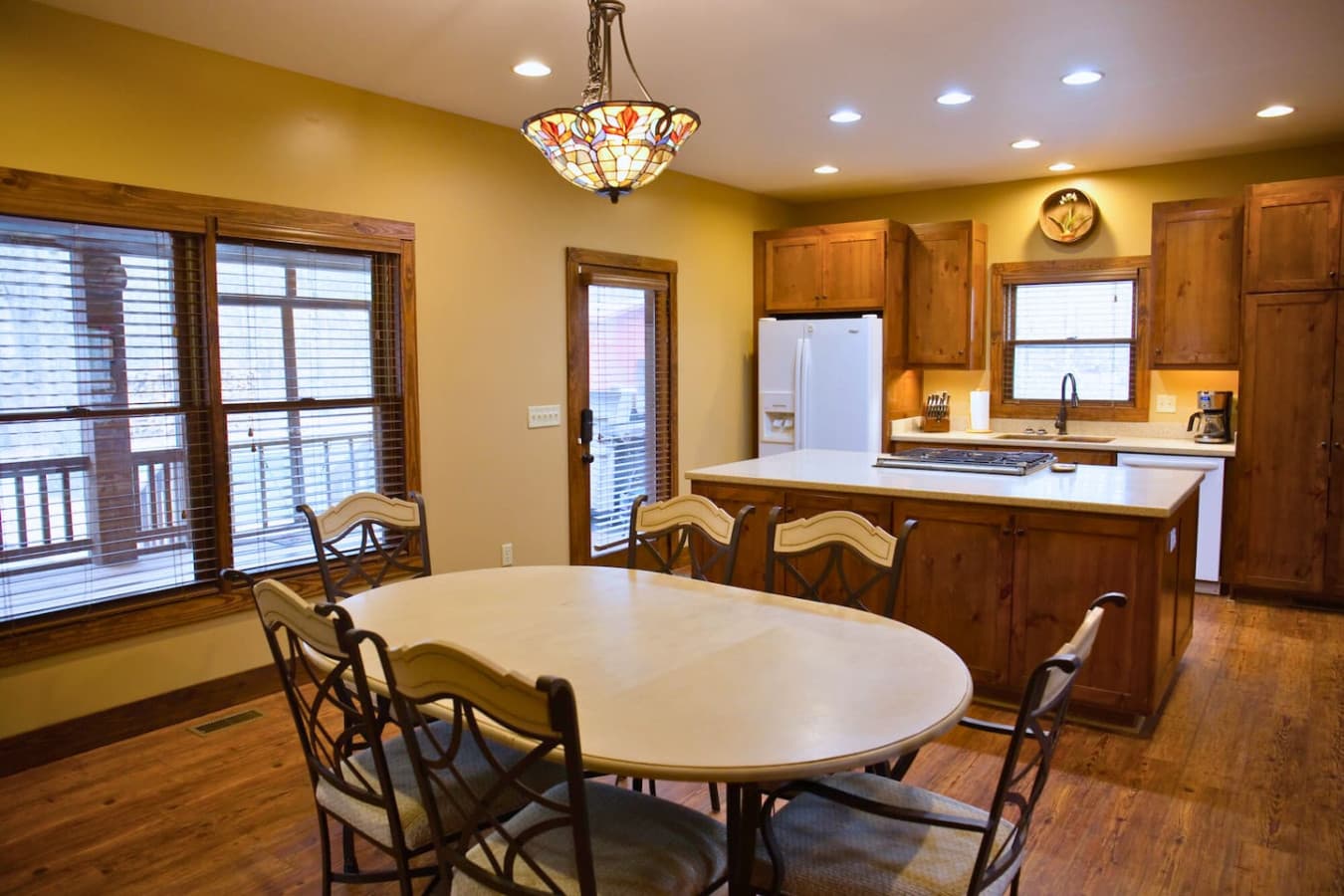 The dining table, located right next to the kitchen, comfortably seats 6.