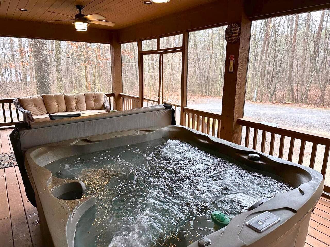 Hot tub on the screened-in porch, available for a $50 fee during your stay!
