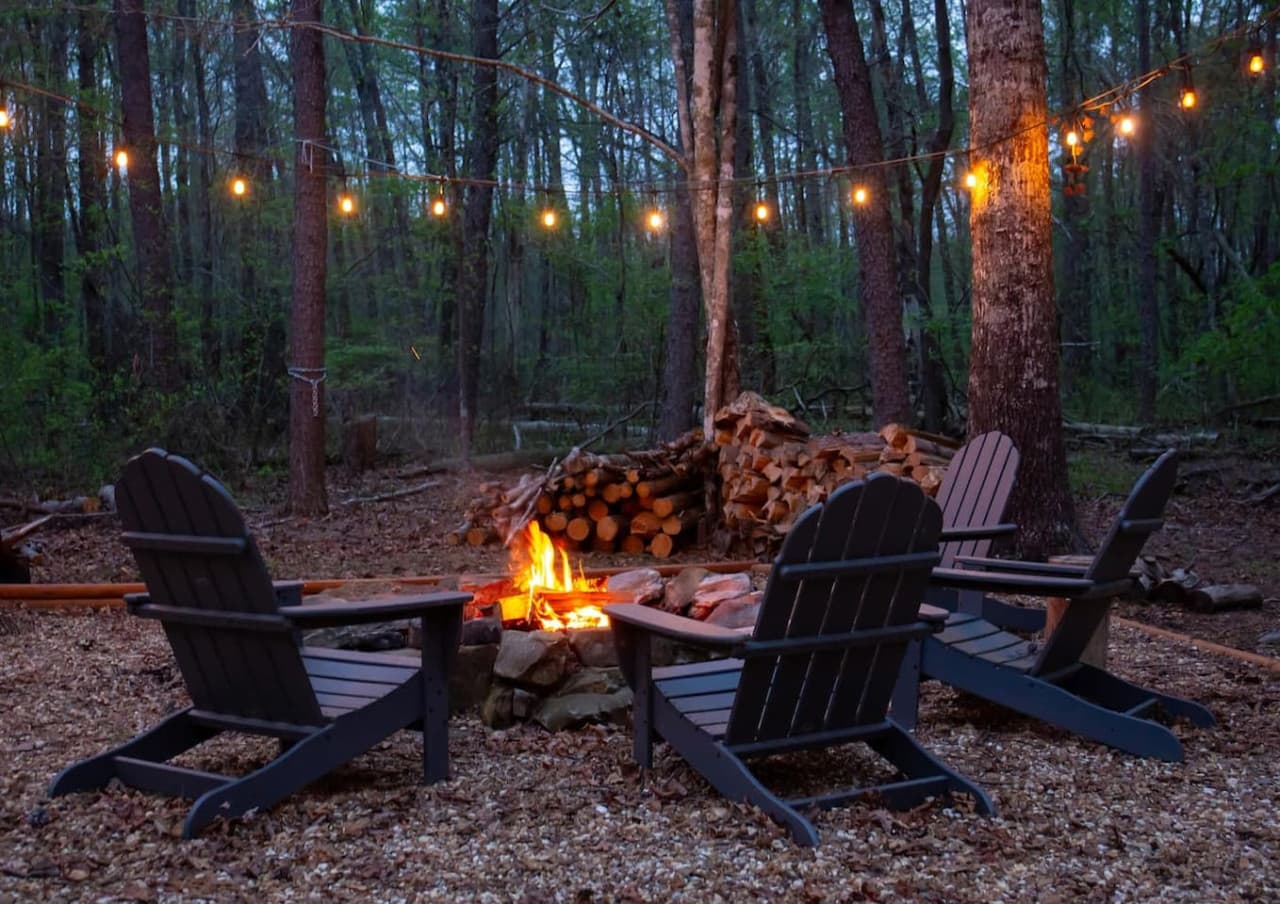Enjoy the warmth of the fire pit with plenty of wood provided for your cozy evenings.