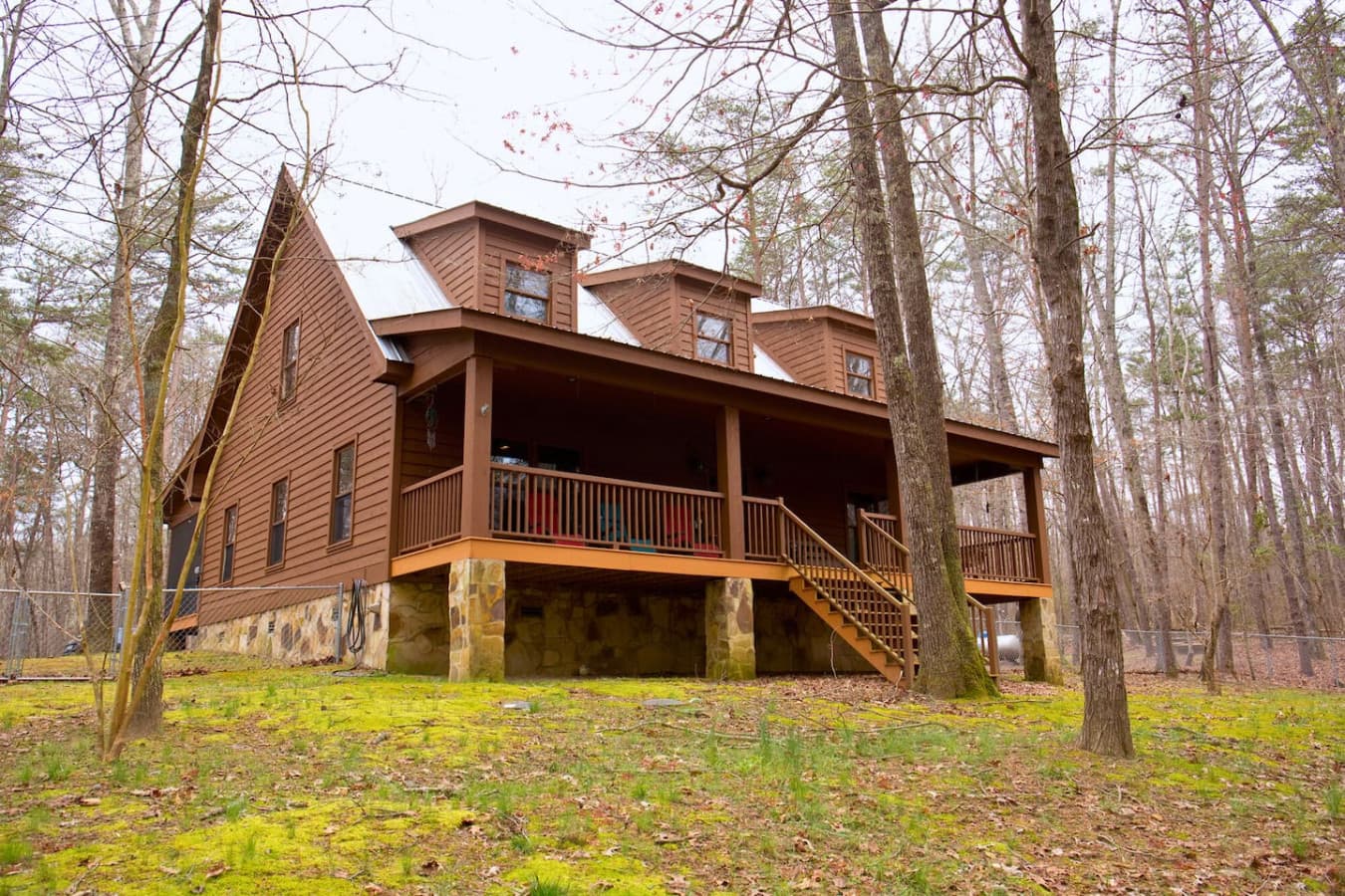 Relax on the large covered porch, overlooking the spacious, fenced-in front yard—ideal for enjoying the outdoors in privacy and comfort.