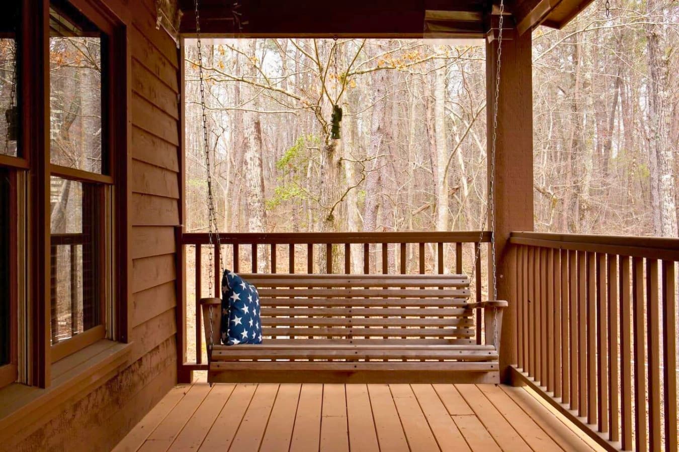 Relax on the front porch swing, a perfect spot to enjoy the fresh air and take in the peaceful surroundings.