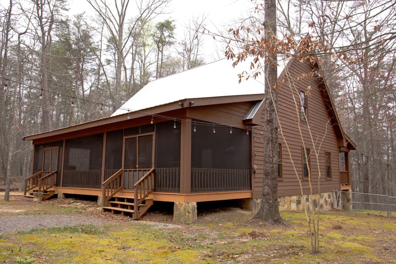 Step out onto the spacious back screened-in porch, where you can enjoy the outdoors without the bugs, perfect for relaxing or dining al fresco.